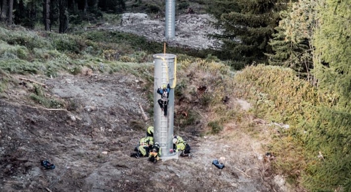 Workmen bolting down a pylon on the new Arpettaz chairlift in Sainte Foy